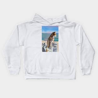 Cat on a fence by the coast Kids Hoodie